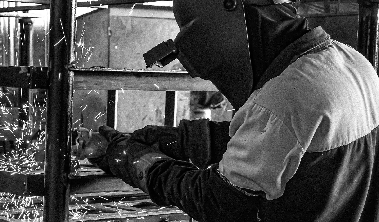 Welder working on a structural assembly at CEMMSA