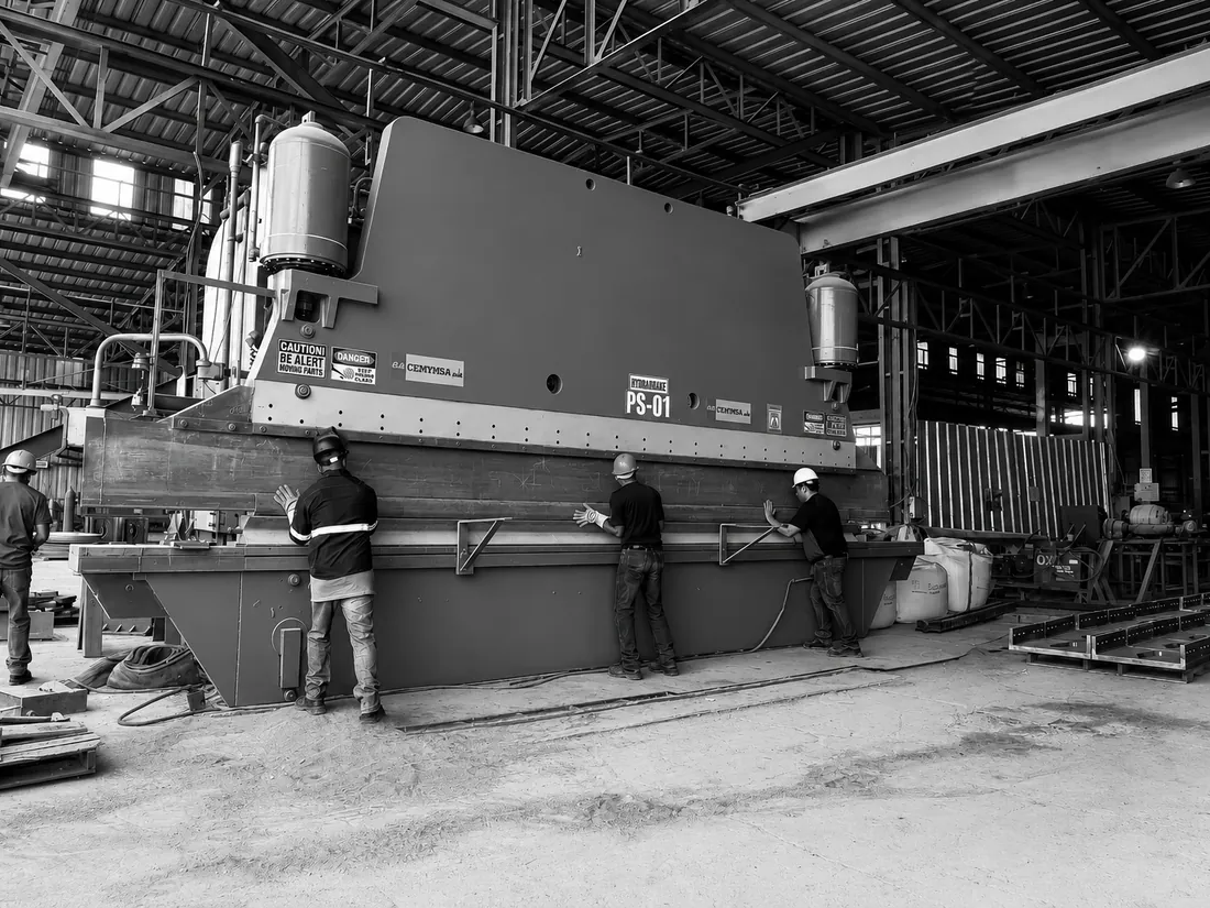 CEMMSA team operating a press brake on the shop floor
