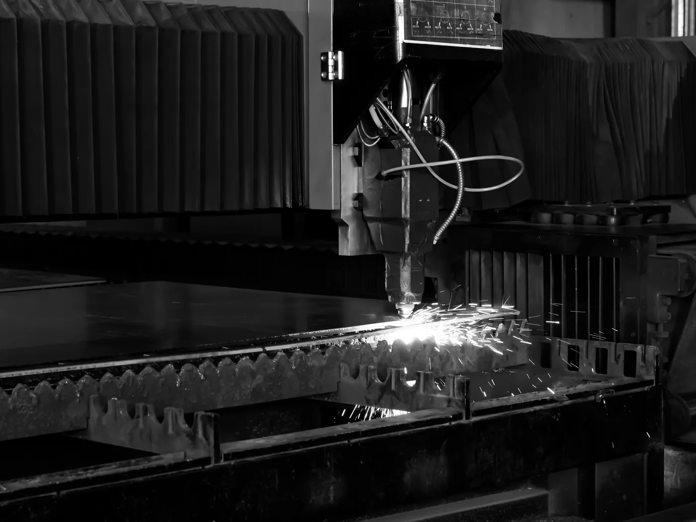 Steel plate cutting with sparks at CEMMSA